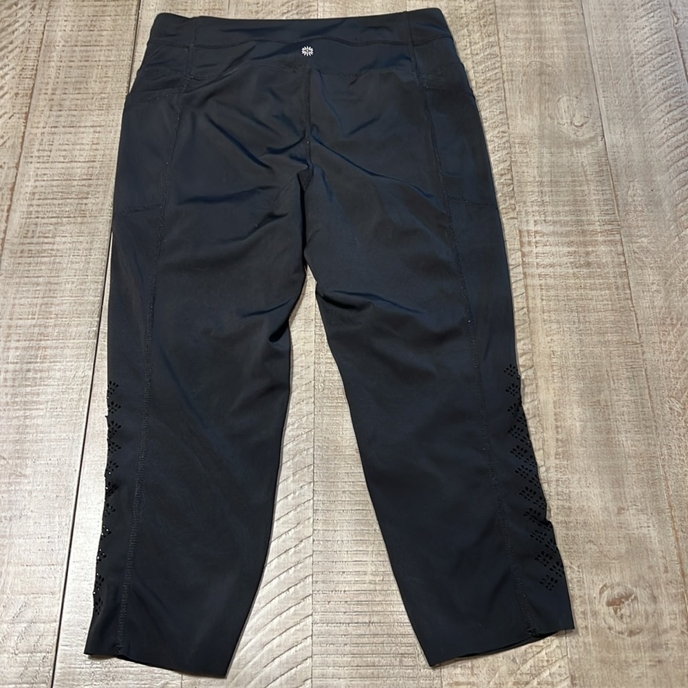 3:$25 Tangerine capri leggings with cute cut outs down outside of each calf. - Picture 5 of 5